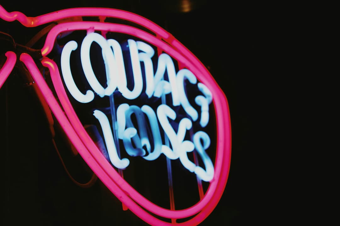 A neon sign that says cobra's loose on it
